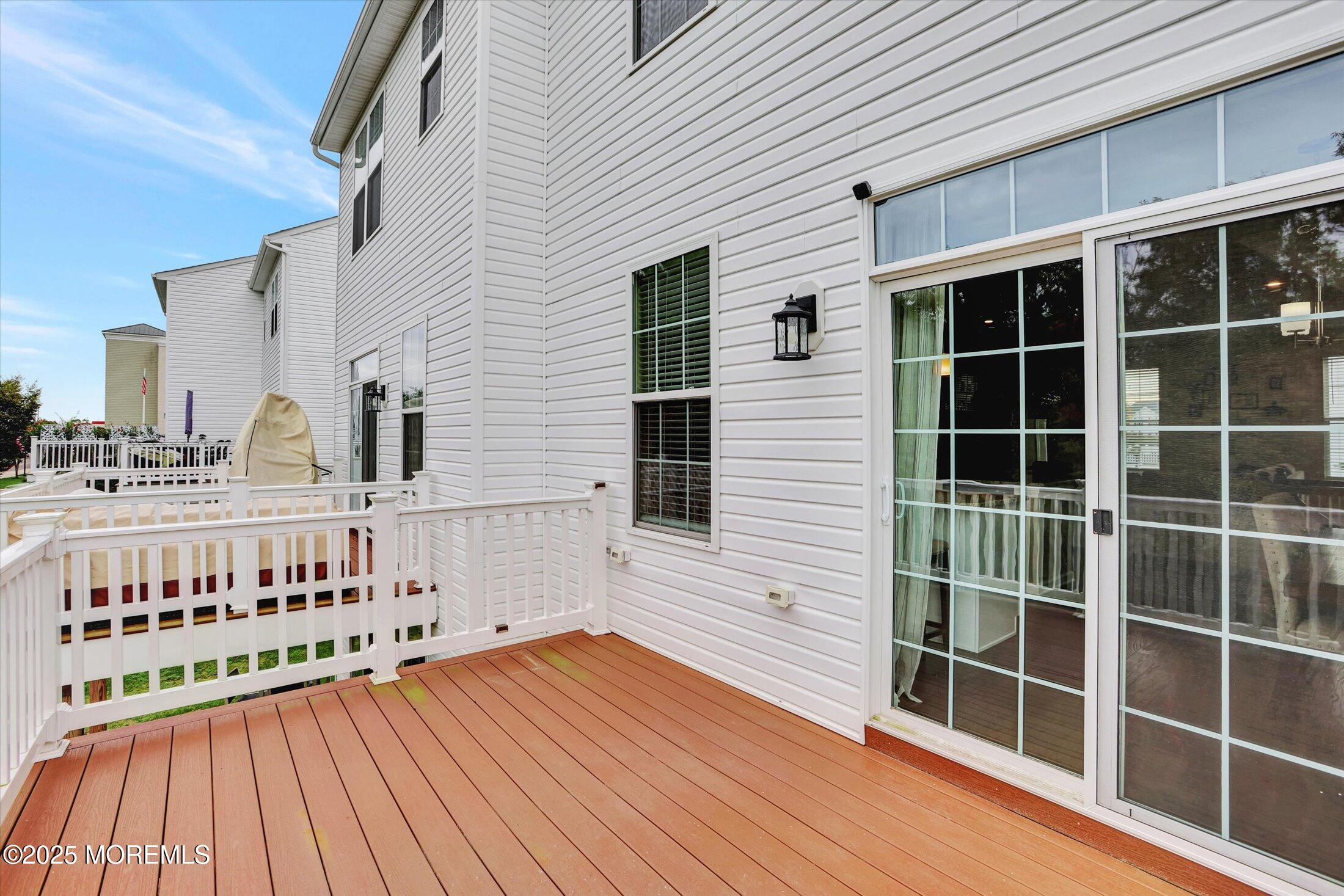 303 Prosper Way, Unit 203 Brick, NJ 08723 - Photo 26 of 36 a view of a balcony with wooden floor