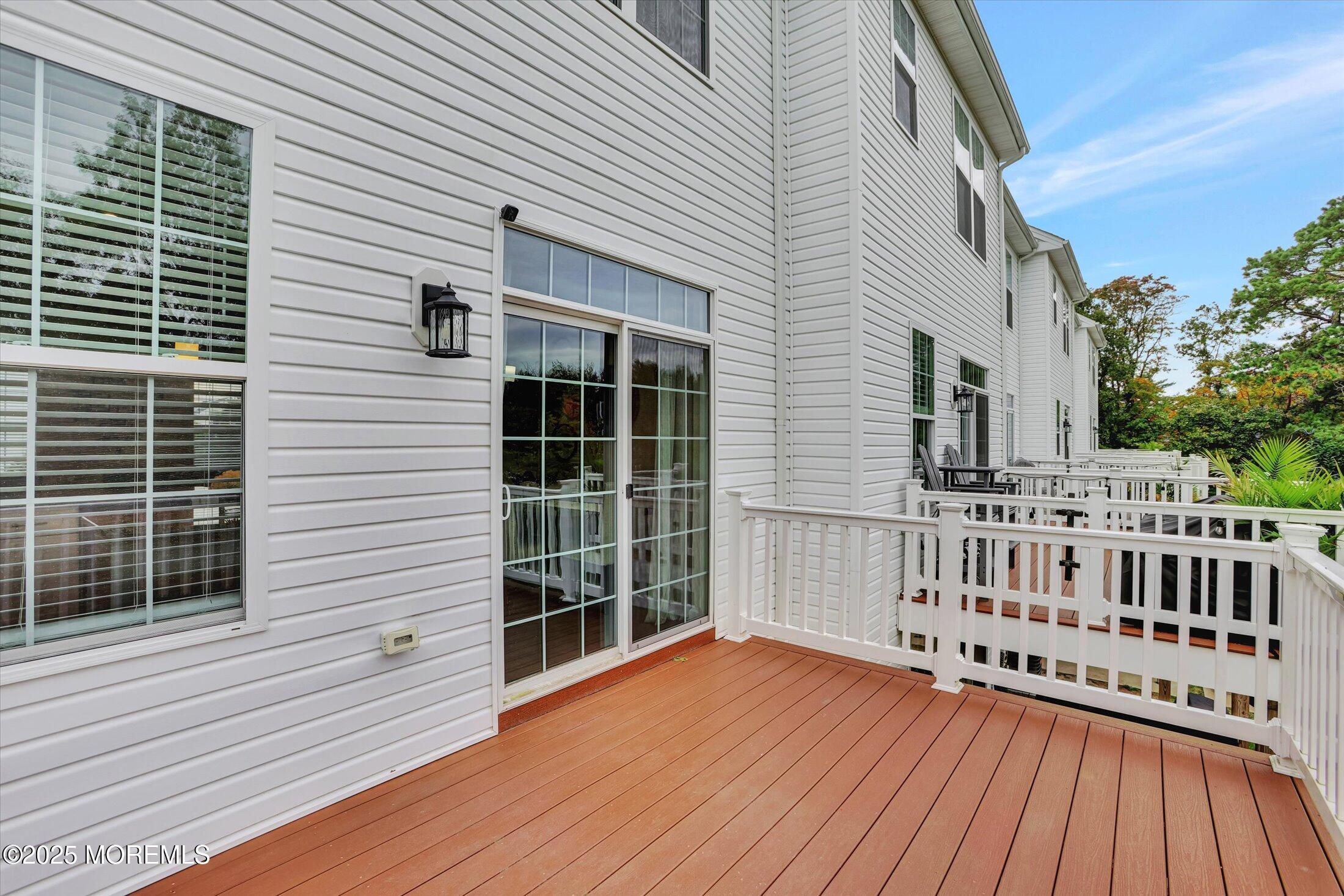 303 Prosper Way, Unit 203 Brick, NJ 08723 - Photo 27 of 36 a view of a house with a wooden deck