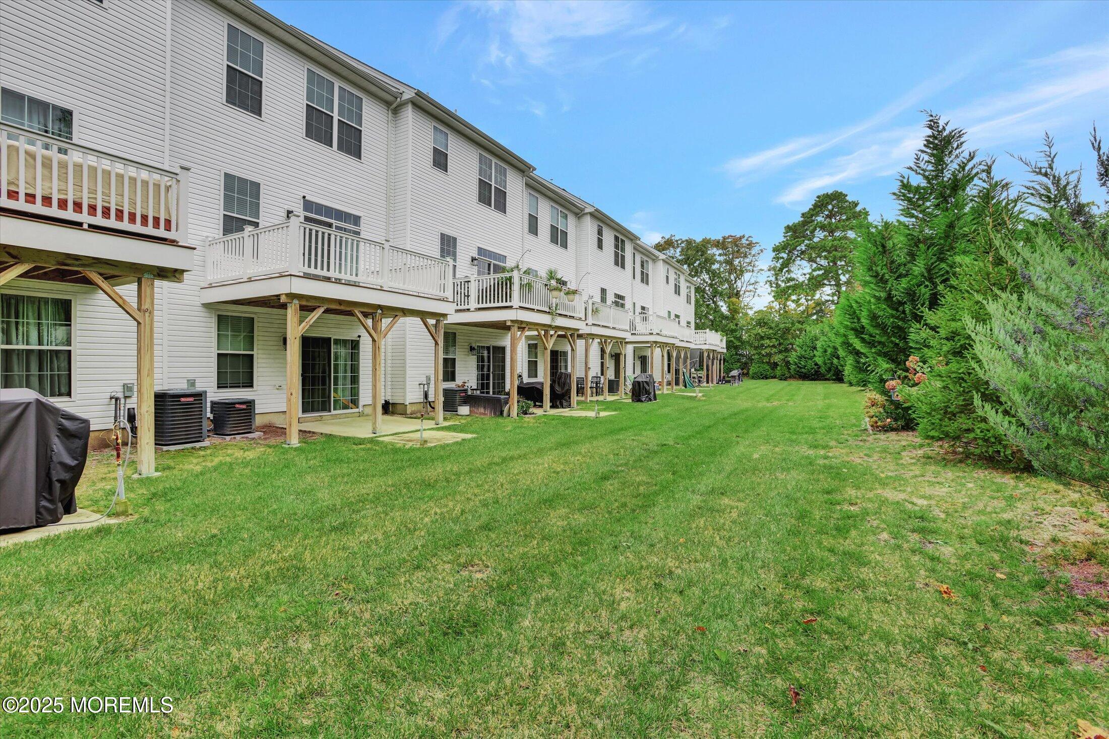 303 Prosper Way, Unit 203 Brick, NJ 08723 - Photo 30 of 36 a view of an apartment with a garden and plants