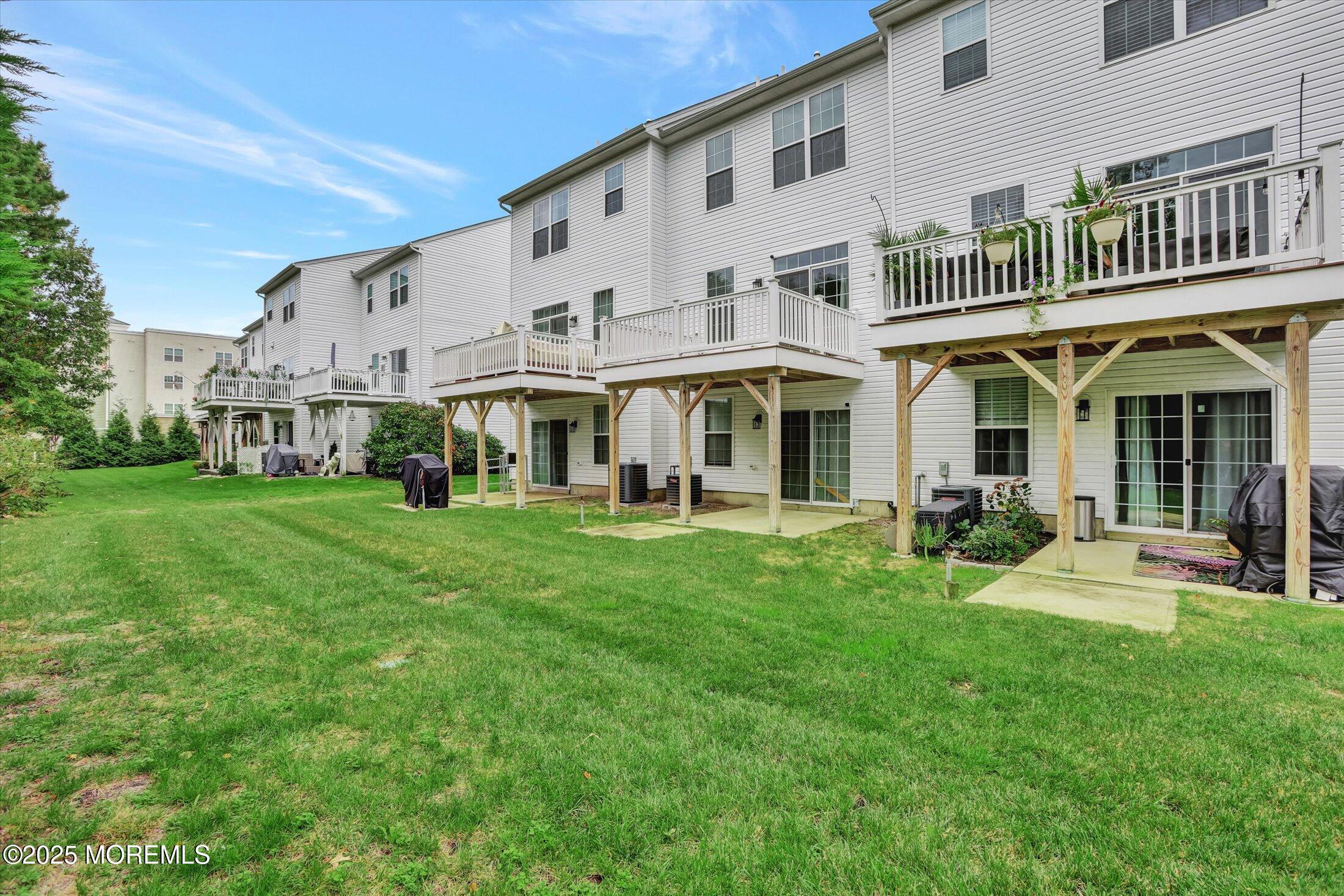 303 Prosper Way, Unit 203 Brick, NJ 08723 - Photo 32 of 36 a view of an house with backyard porch and sitting area