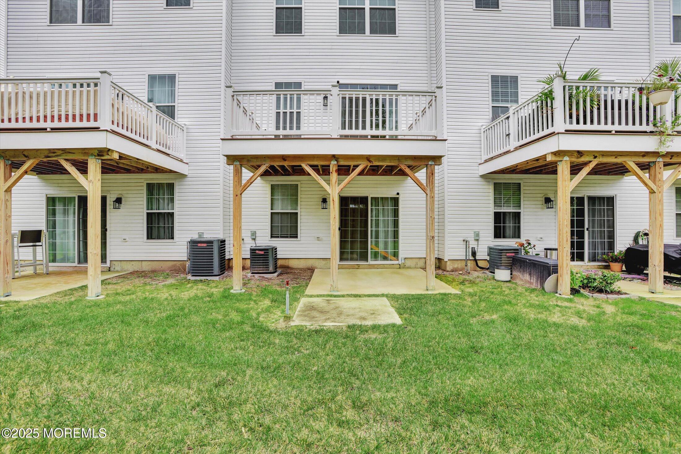 303 Prosper Way, Unit 203 Brick, NJ 08723 - Photo 33 of 36 front view of a building with a garden