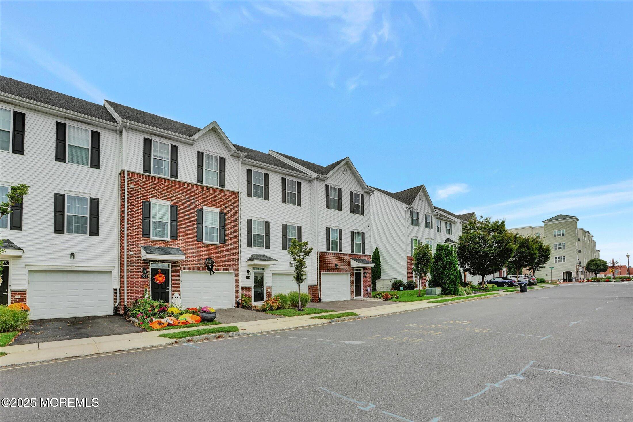 303 Prosper Way, Unit 203 Brick, NJ 08723 - Photo 36 of 36 a view of a street with a building in the background