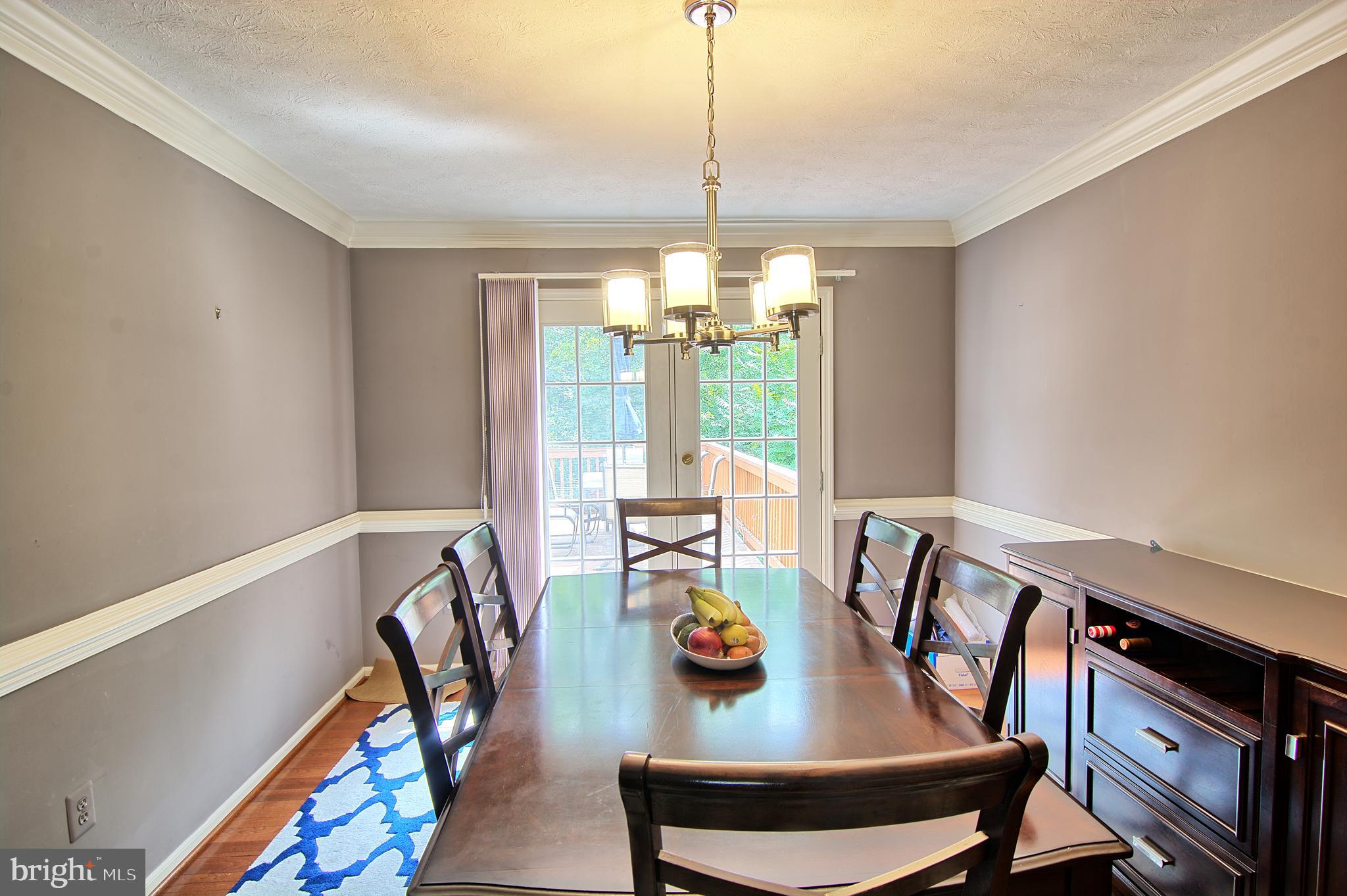 2733 Quarry Heights Way Baltimore, MD 21209 - Photo 17 of 38 Dining Room opens to over-sized Deck & Living Rm
