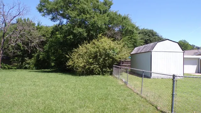 a backyard of a house with lots of green space