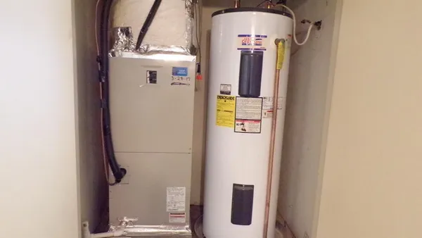 a view of house with backyard and garden