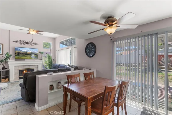 a dining room with furniture and a clock