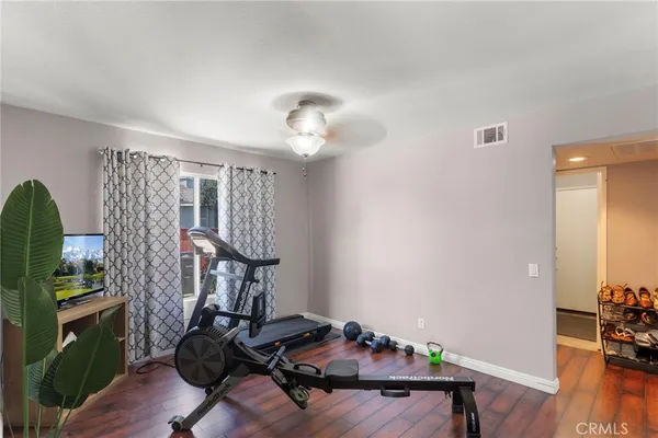 a room with furniture and wooden floor