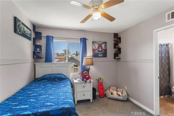 a bedroom with furniture and a chandelier