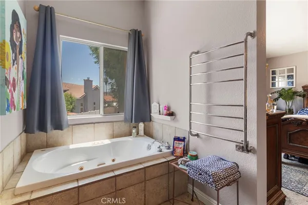 a bathroom with a tub and a sink