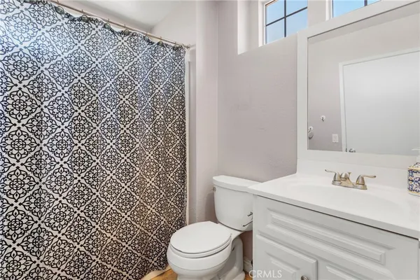 a bathroom with a toilet and a sink