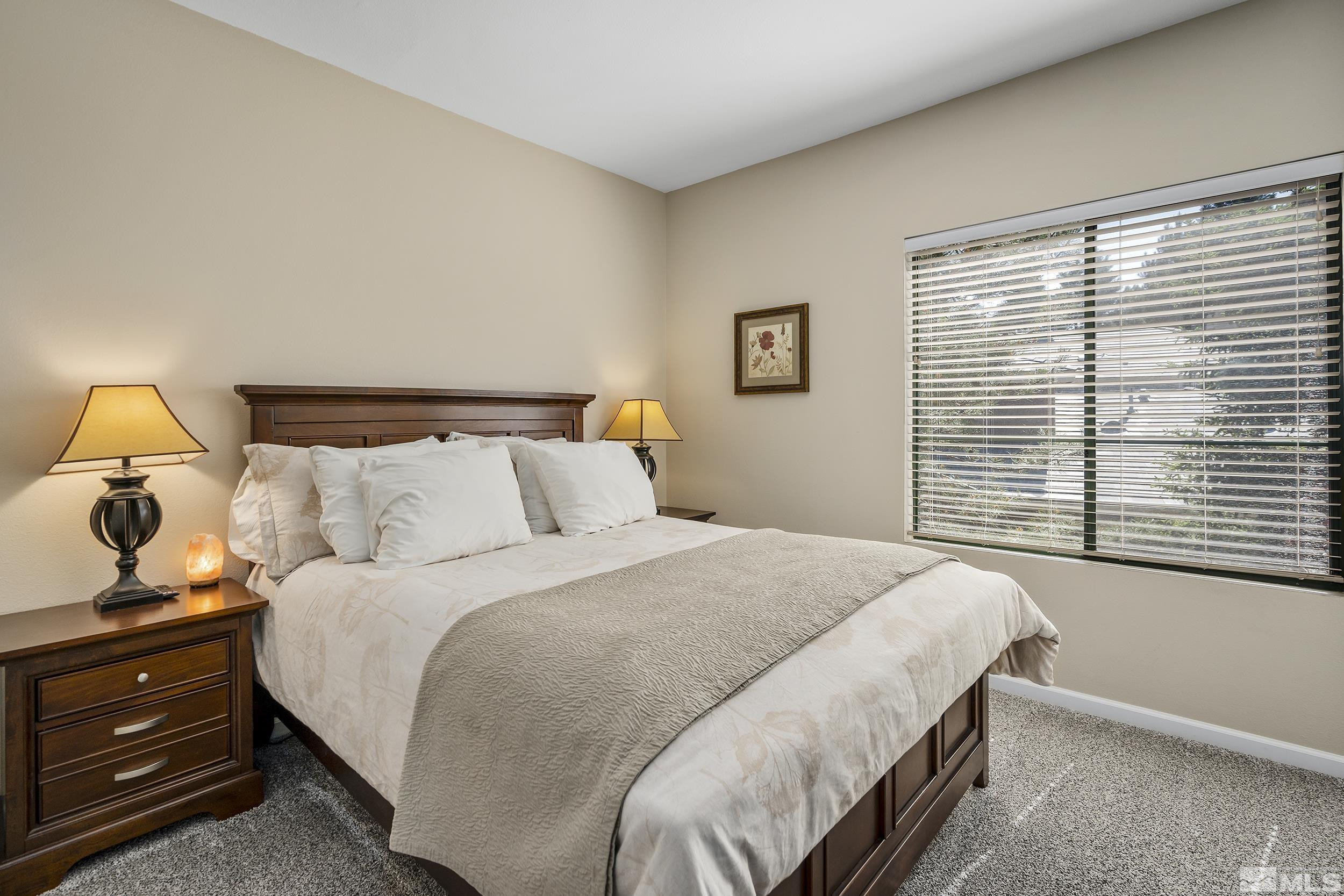 900 South Meadows Parkway, Unit 1621 Reno, NV 89521 - Photo 11 of 23 a bedroom with bed and window