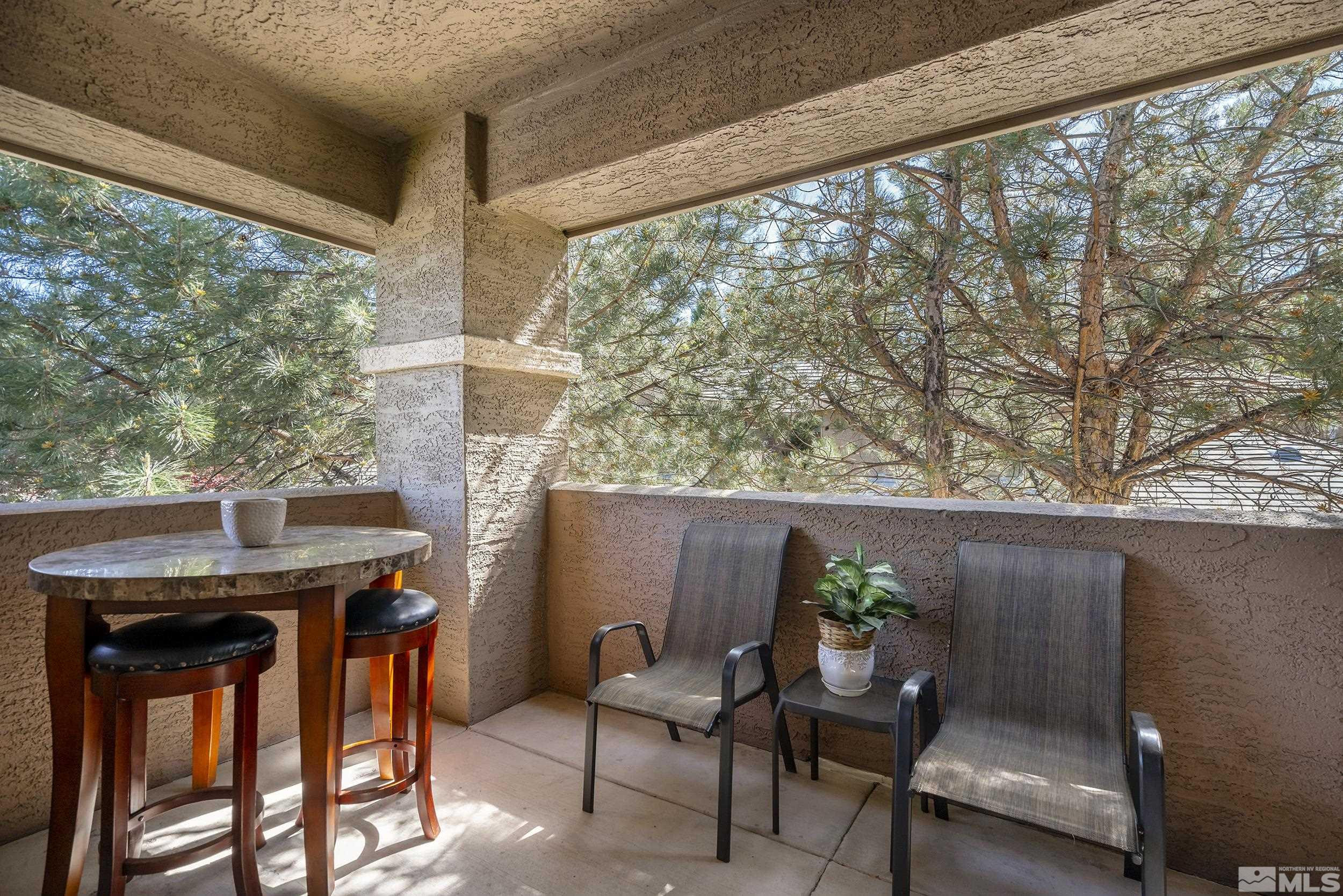 900 South Meadows Parkway, Unit 1621 Reno, NV 89521 - Photo 13 of 23 a view of a porch with furniture and a yard