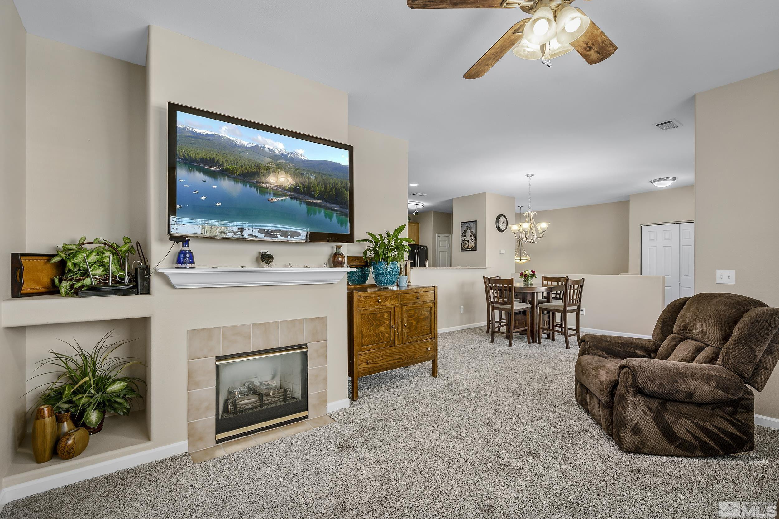 900 South Meadows Parkway, Unit 1621 Reno, NV 89521 - Photo 4 of 23 a living room with furniture and a flat screen tv
