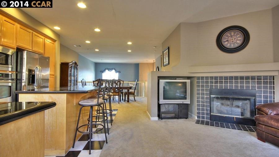 a view of a livingroom with furniture and a fireplace