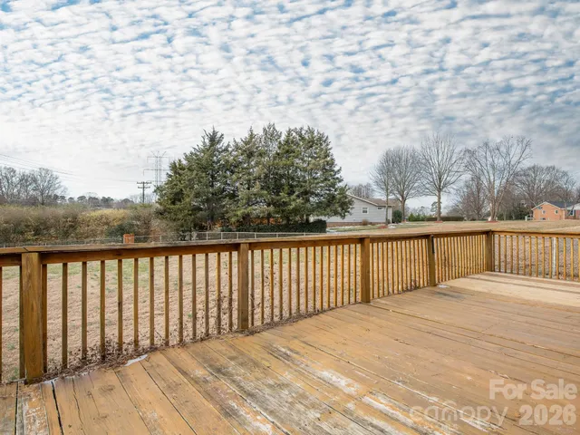 a view of a field with an trees