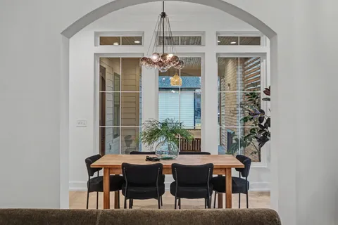 a kitchen with kitchen island a stove a sink and a microwave