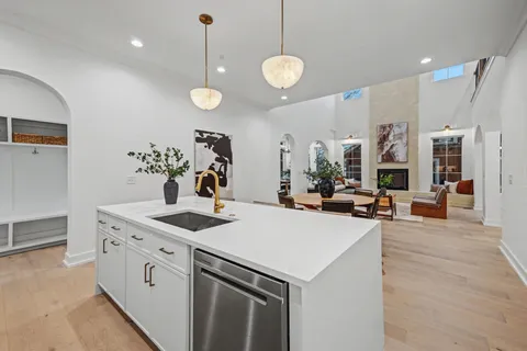 a bedroom with a large bed and a fireplace