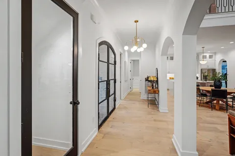 a living room with furniture a fireplace and a large window