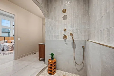 a view of living room filled with furniture and a chandelier