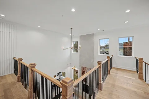 a living room with furniture a rug and a potted plant