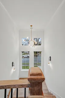 a kitchen with stainless steel appliances a stove a sink refrigerator and microwave