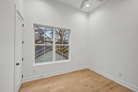 a bathroom with a sink a toilet a vanity and a shower