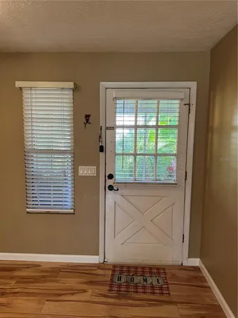 a kitchen with a refrigerator and cabinets