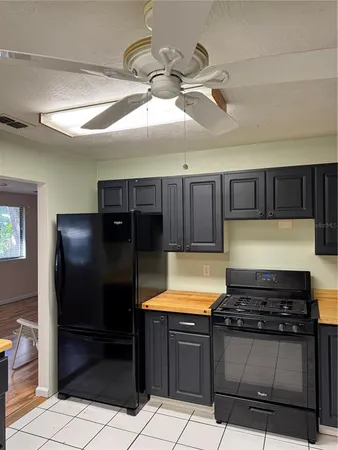 a fan sitting in a room next to a window