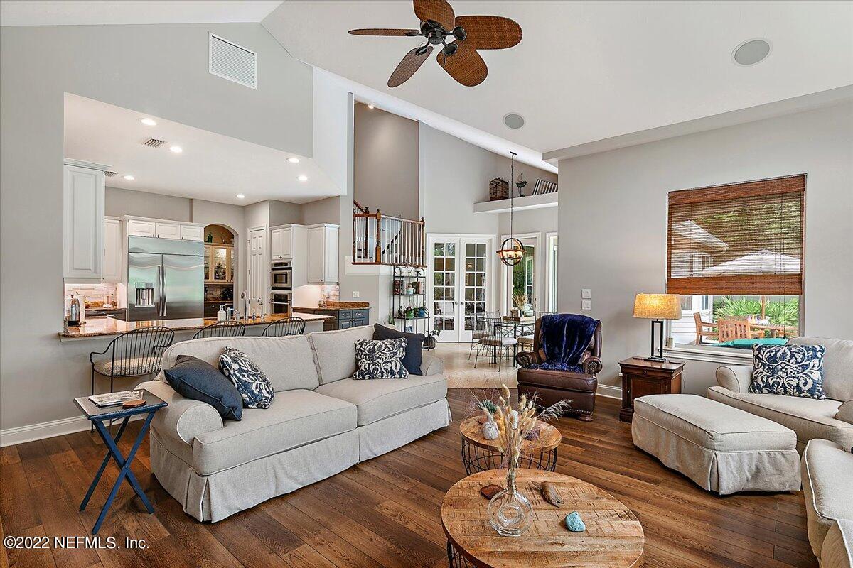 649 Treehouse Circle St. Augustine, FL 32095 - Photo 16 of 71 a living room with furniture kitchen view and a large window