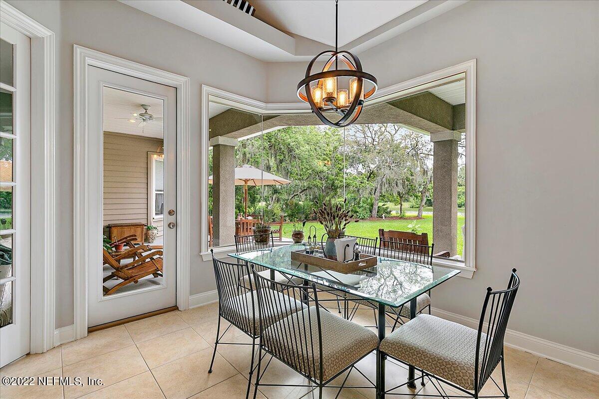 649 Treehouse Circle St. Augustine, FL 32095 - Photo 18 of 71 a view of a dining room with furniture window and outside view