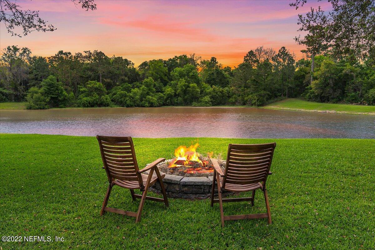 649 Treehouse Circle St. Augustine, FL 32095 - Photo 20 of 71 a view of an chairs and table in the garden