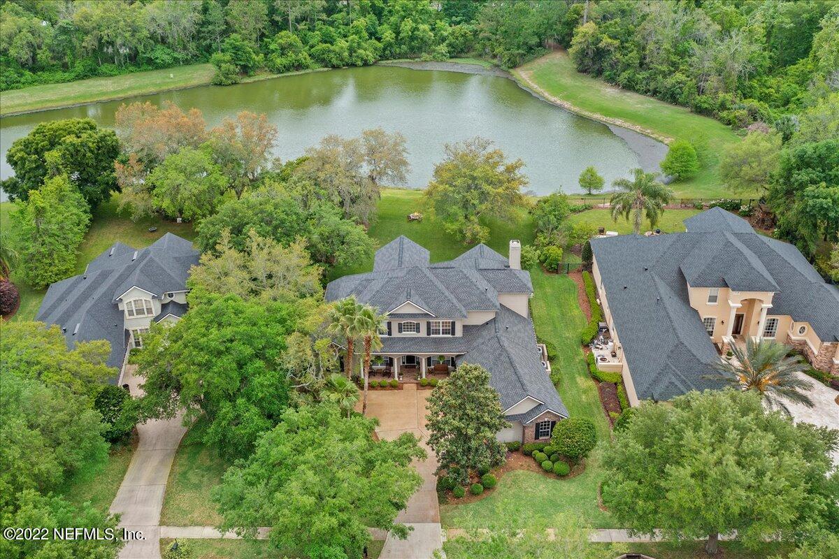 649 Treehouse Circle St. Augustine, FL 32095 - Photo 2 of 71 an aerial view of a house with a lake view