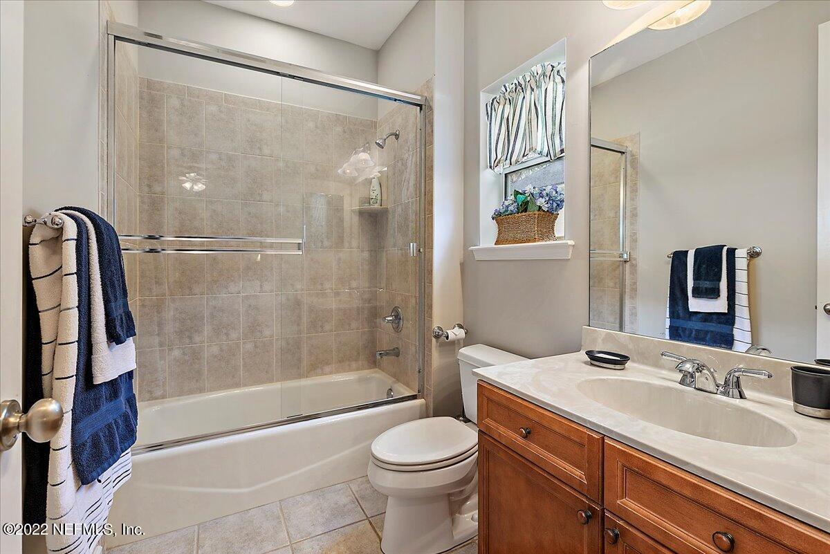 649 Treehouse Circle St. Augustine, FL 32095 - Photo 36 of 71 a bathroom with a sink toilet and shower