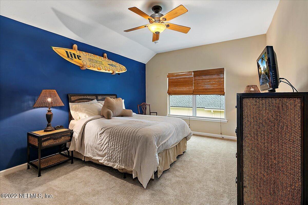 649 Treehouse Circle St. Augustine, FL 32095 - Photo 42 of 71 a bedroom with a bed and a window