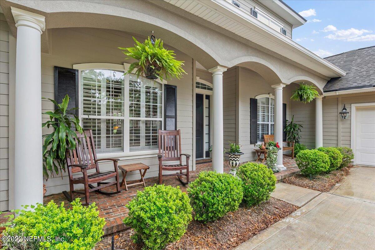 649 Treehouse Circle St. Augustine, FL 32095 - Photo 5 of 71 a front view of house with yard and outdoor seating