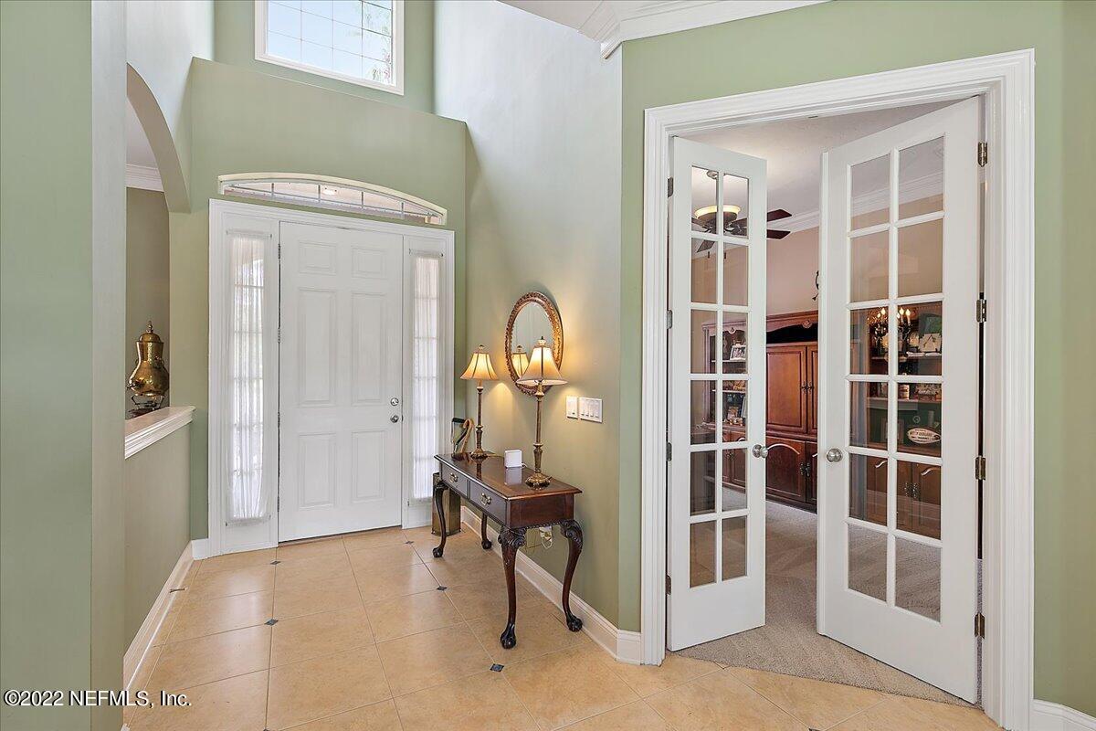 649 Treehouse Circle St. Augustine, FL 32095 - Photo 6 of 71 a view of a livingroom with furniture and front door