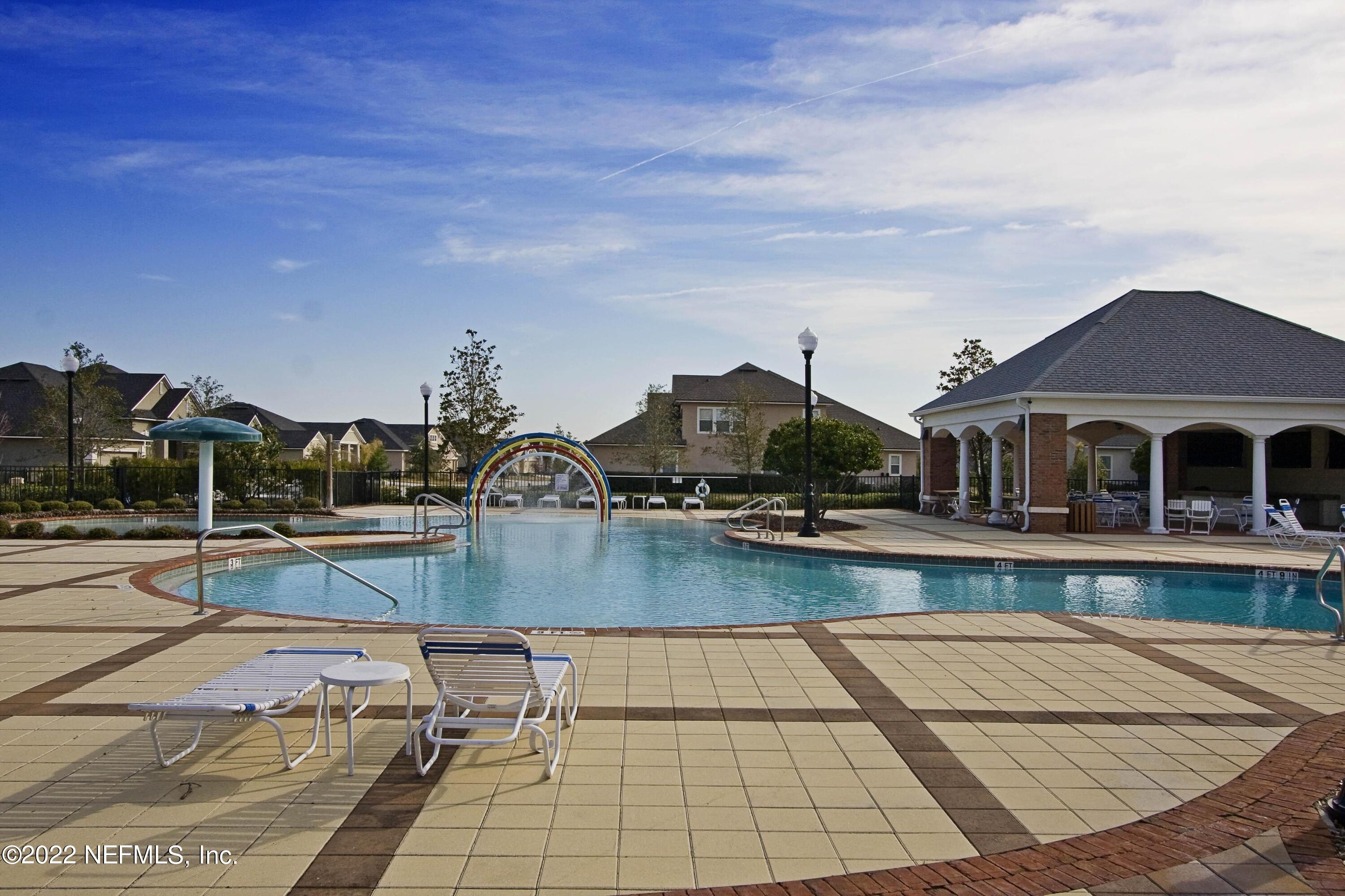 649 Treehouse Circle St. Augustine, FL 32095 - Photo 66 of 71 a view of a swimming pool with seating space
