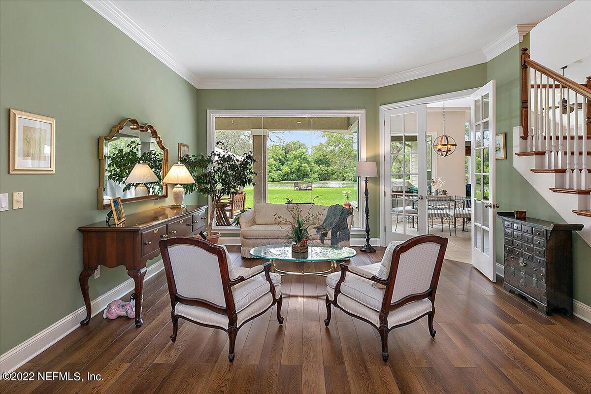 649 Treehouse Circle St. Augustine, FL 32095 - Photo 7 of 71 a dining room with furniture window and wooden floor