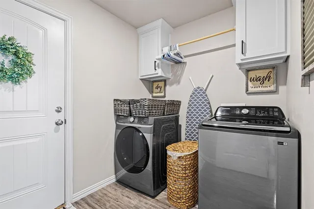 a view of storage and utility room with washer and dryer