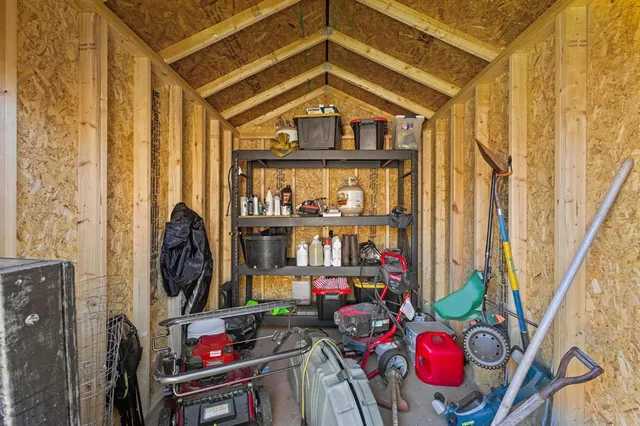 a view of a entryway with storage and utility room