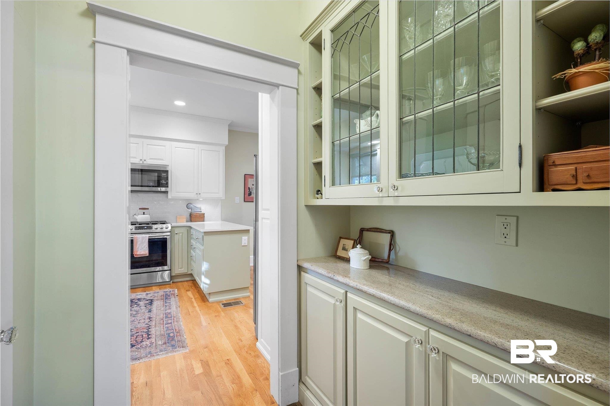 2 Westgate Road Mobile, AL 36608 - Photo 13 of 63 Butler's Pantry featuring stainless steel appliances, light wood finished floors, glass fronted cabinets, recessed lighting, and white cabinetry