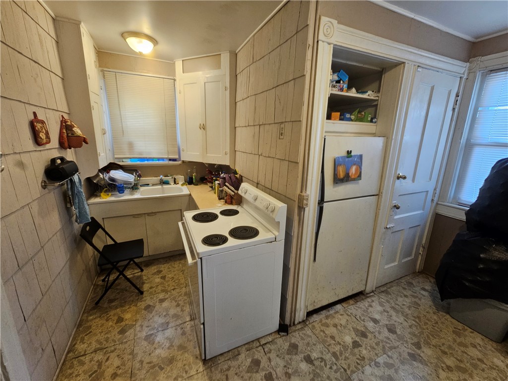 204 Cypress Street Rochester, NY 14620 - Photo 21 of 40 1st floor unit 204 kitchen w basement door