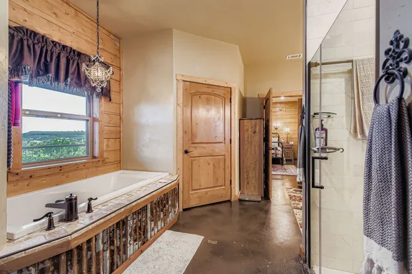 a kitchen with stainless steel appliances granite countertop a refrigerator and a stove