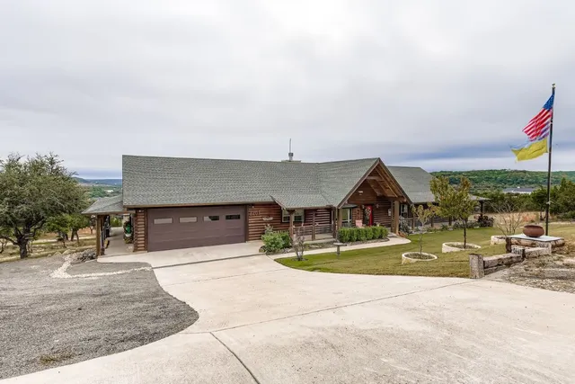 a view of a house with entertaining space and plants