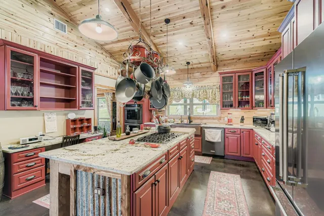 a kitchen that has a lot of cabinets in it
