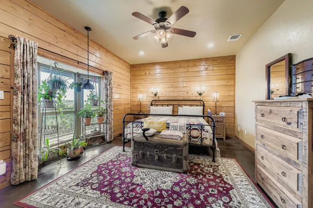 a bedroom with furniture and a window