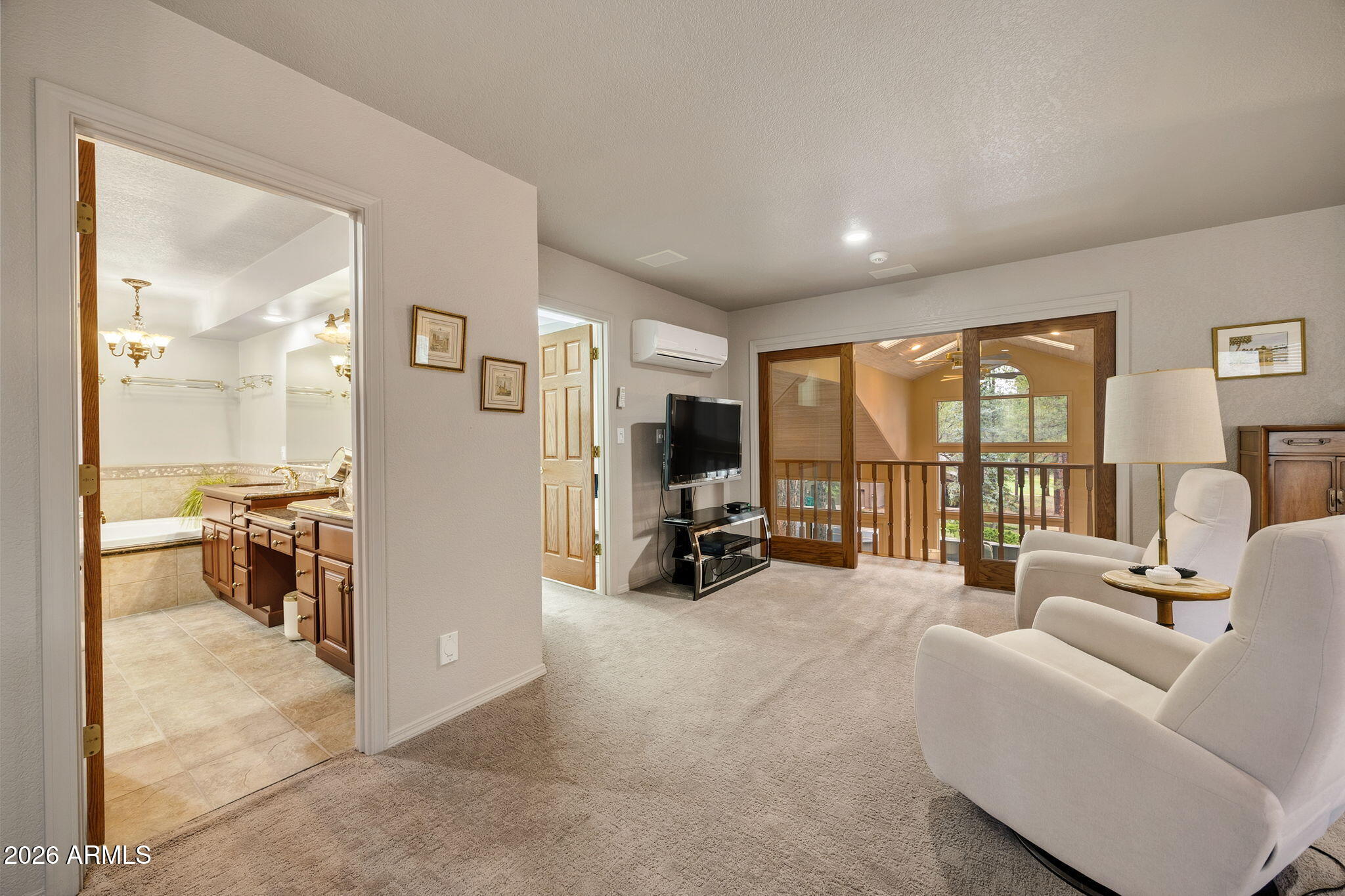5779 Griffiths Spring Flagstaff, AZ 86005 - Photo 20 of 43 Primary Bedroom Seating Area