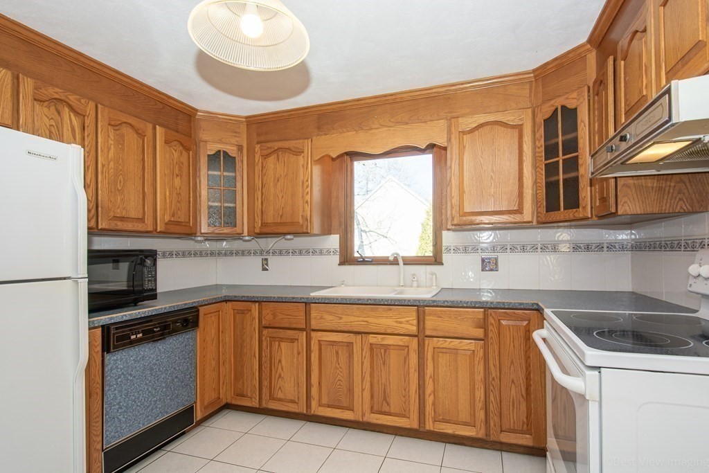 54 Carpenter Road Northbridge, MA 01588 - Photo 15 of 42 a kitchen with stainless steel appliances granite countertop a sink and cabinets
