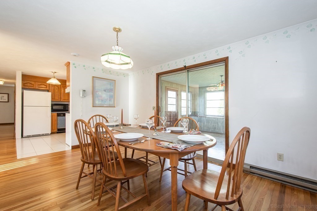 54 Carpenter Road Northbridge, MA 01588 - Photo 20 of 42 a view of a dining room with furniture window and wooden floor