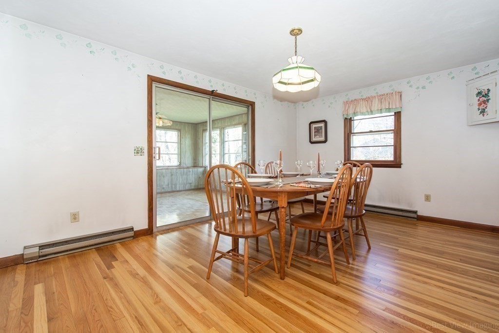54 Carpenter Road Northbridge, MA 01588 - Photo 22 of 42 a view of a dining room with furniture and wooden floor